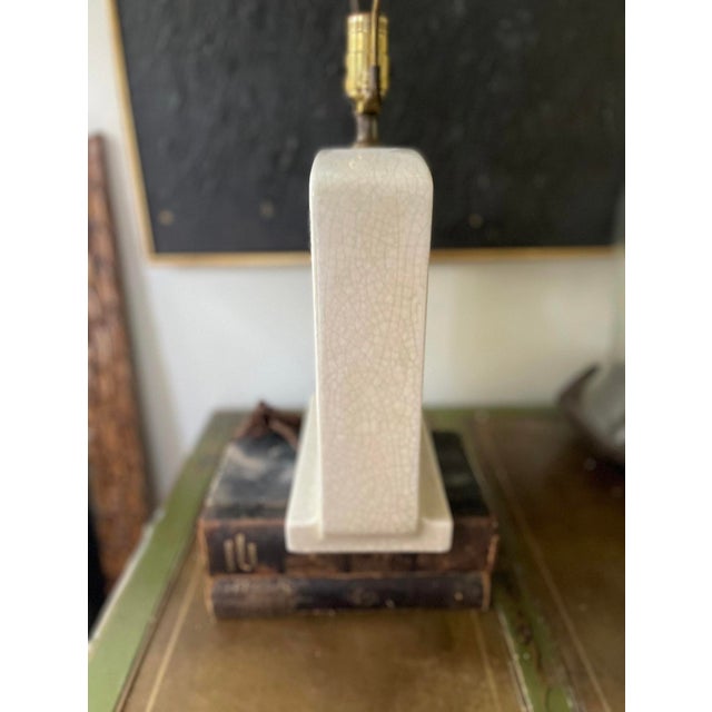 Wonderful mid century, modern Asian table lamp, presented in a creamy glaze that has intentional cracklature of light gray...