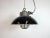 Industrial hanging lamp manufactured by Elektrosvit in former Czechoslovakia during the 1960s. It features a black enamel...