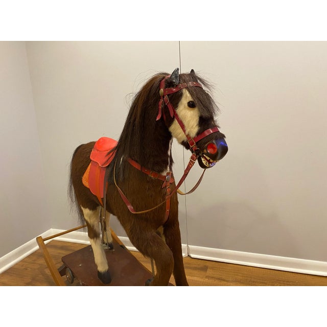 This is a Nikolaus Klein rocking horse. He carved the wood features, fabricated the rockers, and made the form of the...