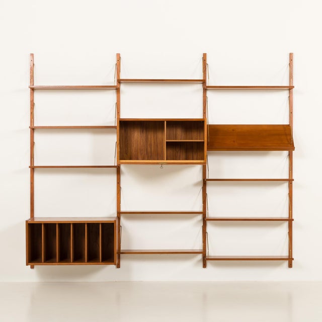 This elegant mid-century shelving unit with a vinyl records cabinet was designed by preben sorensen for ps system and...