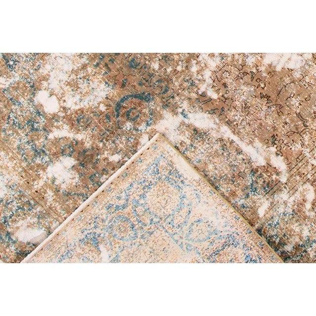 Vintage hand-knotted Persian Tabriz. Good condition. Low pile. This rug measures 6'1" x 10'2".