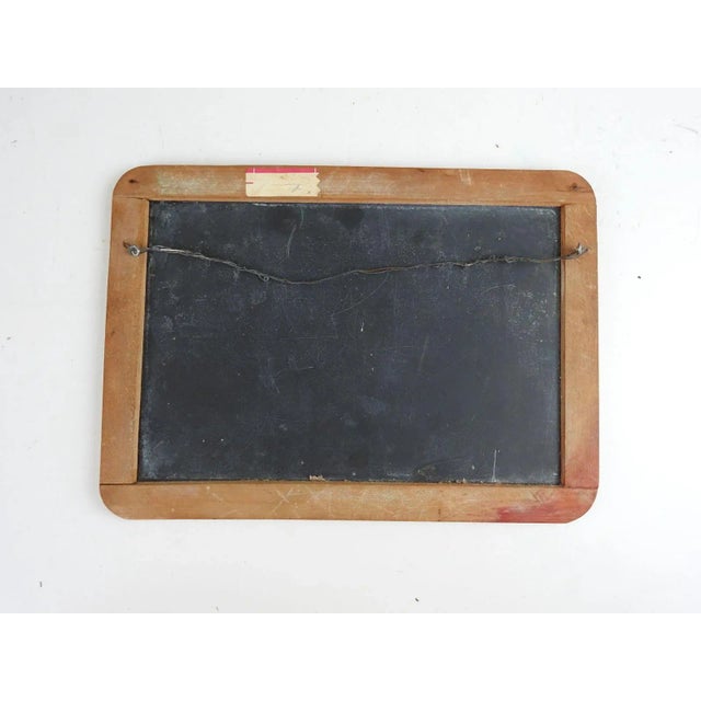 Antique early 20th century folk art painting on a schoolroom writing slate. Winter scene of house on a frozen lake, has...