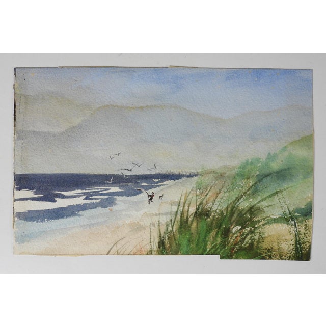 Mid 20th century watercolor on paper painting of surf fisherman on the beach with sand dunes in the foreground. Unsigned....