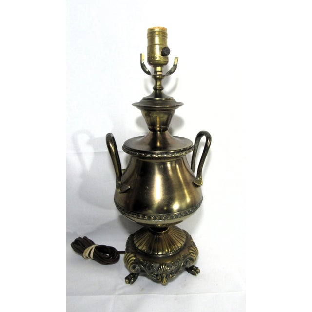 Heavy 6.5 pound , 17 inches tall table lamp. Looks and feels like brass but there is another metal peeping out at the...