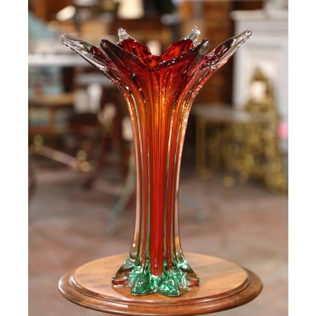 Introduce brilliant color and sculptural movement to an interior with this striking vintage Italian art-glass vase....