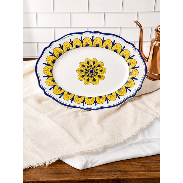 The Stratificata Oval Platter brings the artistry and character of traditional Deruta ceramics to a generous, elongated...