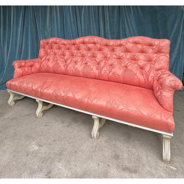 An impressive French 19th century Neo-Baroque style sofa measuring 98 inches in length. The sofa is upholstered in a...