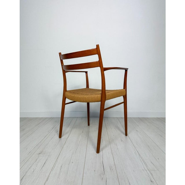 Beautiful mid-century danish teak dining armchair. Seat with original woven papercord. Model gs700. Design in the 1950s by...