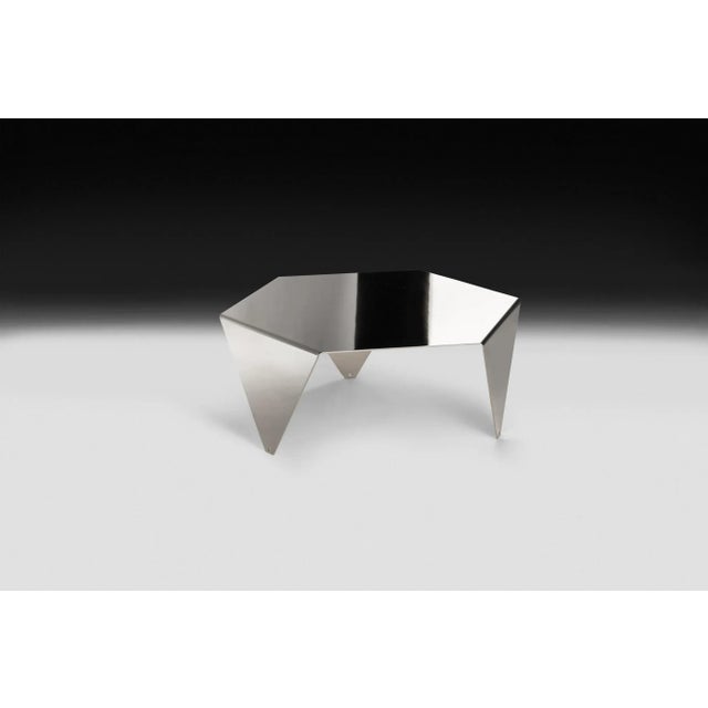 <p>The <em>Ruche</em> coffee table is made in galvanized metal with a black nickel finish.</p>