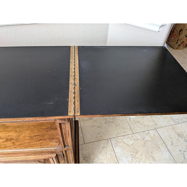 Bring timeless warmth to your dining room or living space with this handsome vintage American Traditional style flip-top...