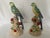 A beautiful pair of porcelain parrot statues in the majolica style. A classic addition to your table or set upon wall...