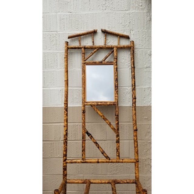 Antique tiger bamboo umbrella stands with a decorative square centerpiece. This stand features three slots for storing...