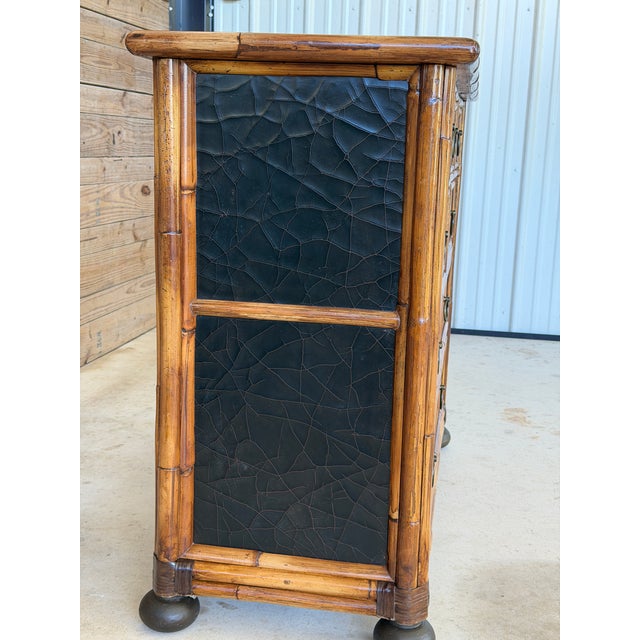 A striking vintage faux bamboo chest by Milling Road for Baker Furniture, blending British Colonial influence with the...