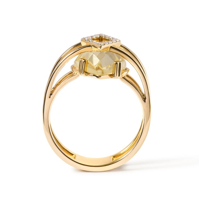 Discover the allure of sophistication with this magnificent cocktail ring, cradling a 15x15 mm marquise-cut yellow topaz...