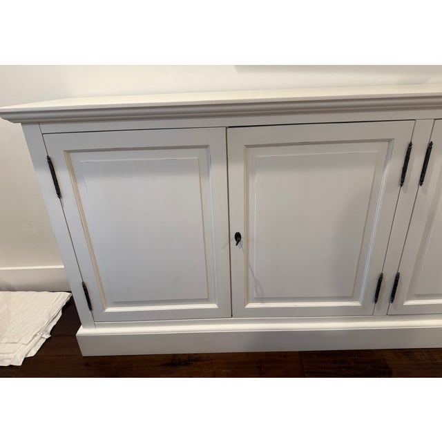 Restoration Hardware French Country sideboard with slight intentional "weathered" look on edges. It has 1 shelf inside...