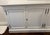 Restoration Hardware French Country sideboard with slight intentional "weathered" look on edges. It has 1 shelf inside...