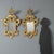 Pair of small carved and gilded wooden mirrors. Frame with openwork carvings of scrolls, leaves, and curls; mercury...