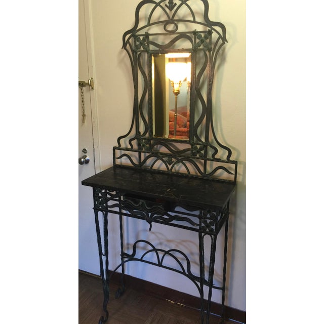 Art Nouveau Wrought Iron Console Table and Mirror featuring whiplash curves, stylized plant-like scrolls with floral...