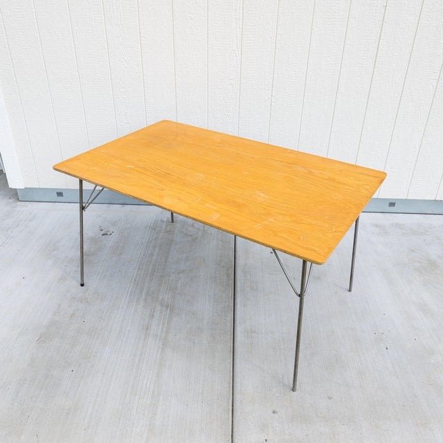1950s Charles and Ray Eames for Herman Miller DTM-1 folding dining table. Designed in the postwar era as a "honest,"...
