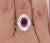 Metal 2.19 Carat Oval Cut Ruby and Baguette Diamond Halo Platinum Ballerina Ring For Sale - Image 7 of 8
