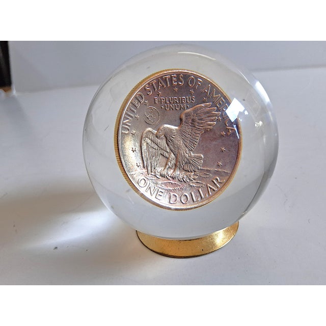 The 1972 Eisenhower One Dollar Coin Crystal Ball Style Acrylic Paperweight is a unique and decorative collectible item....