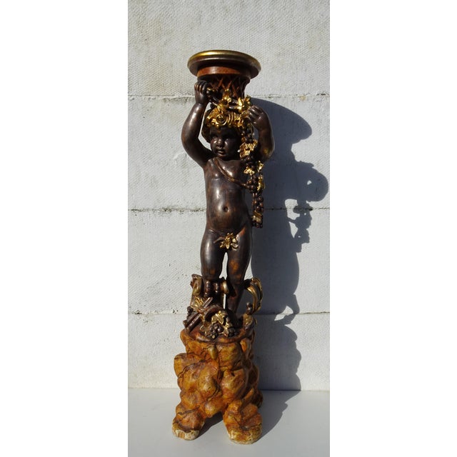 Italian Gilded and Carved Wooden Cherub Pedestal Plant Stand, 1970s, in Good conditions. Designed 1970 to 1979