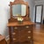 Antique tiger oak vanity dresser featuring beautiful quarter-sawn oak grain, an ornate carved mirror frame, and classic...
