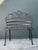 This vintage wrought iron garden bench is a charming example of French Provincial-inspired outdoor design. Hand-crafted...