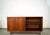 Vintage original Mid century Modern sliding door credenza for sale. It has two sliding doors that open up to an adjustable...