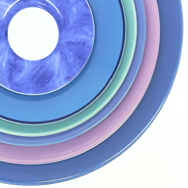 Cool-toned wall plate curation, group of 7. Enhance your space with this eccentric collection of decorative plates, in a...