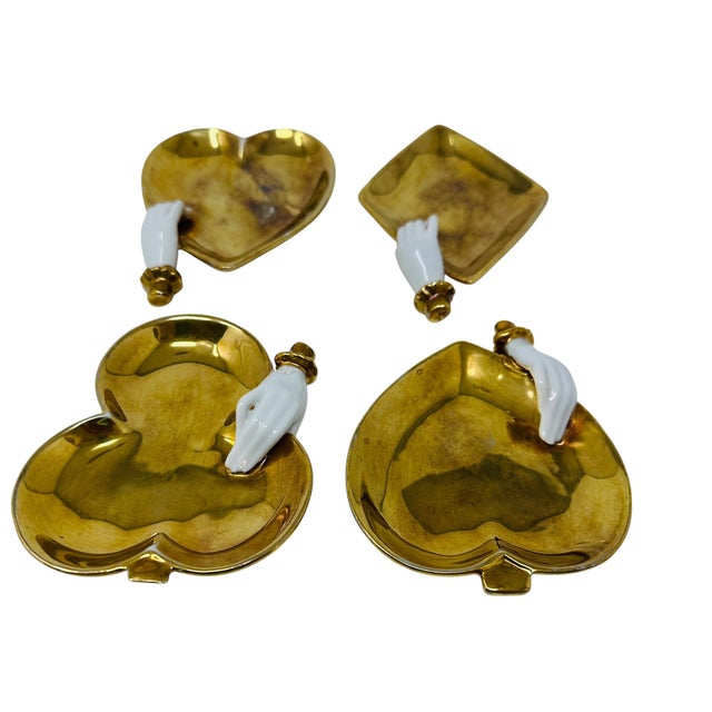 A rare and striking complete "Bridge Set" of four (4) vintage mid-century modern trinket dishes, representing the suits of...