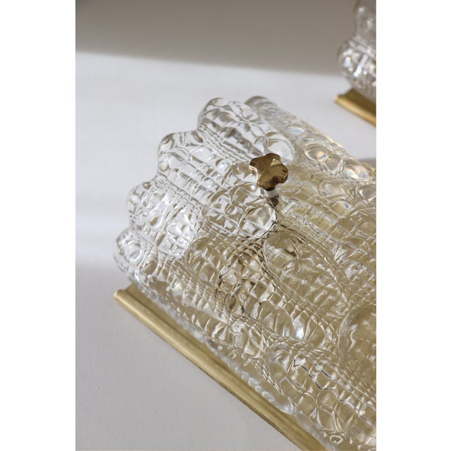 Superb pair of wall sconces in genuine brass and glass, 1960. designed by carl fagerlund. produced in collaboration...