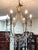 The Cyan Designs Luciana 6-Light Chandelier in the St. Regis Bronze finish is a stunning statement piece featuring...