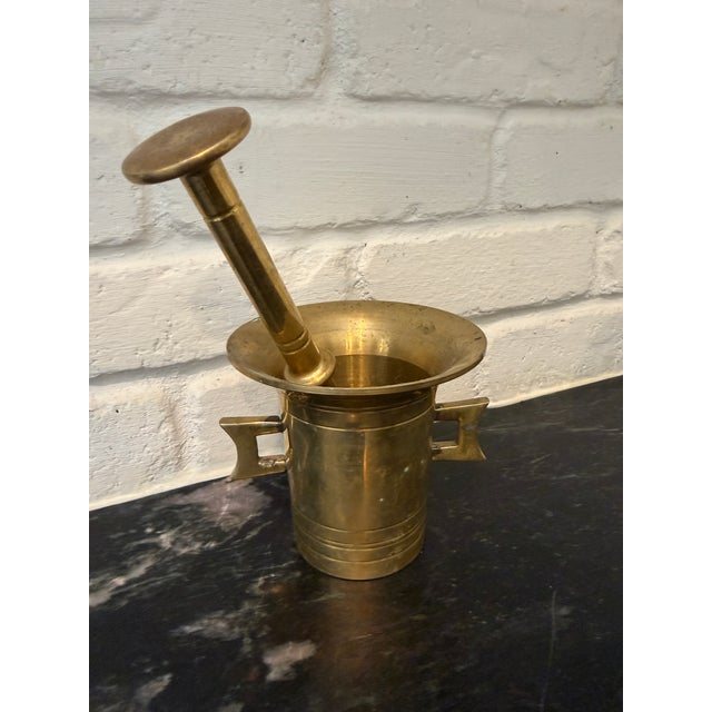 Buttery warm beautiful brass mortar and pestle. Vintage if not antique. Unmarked. Lovely substantial piece. Mortar: 4”...
