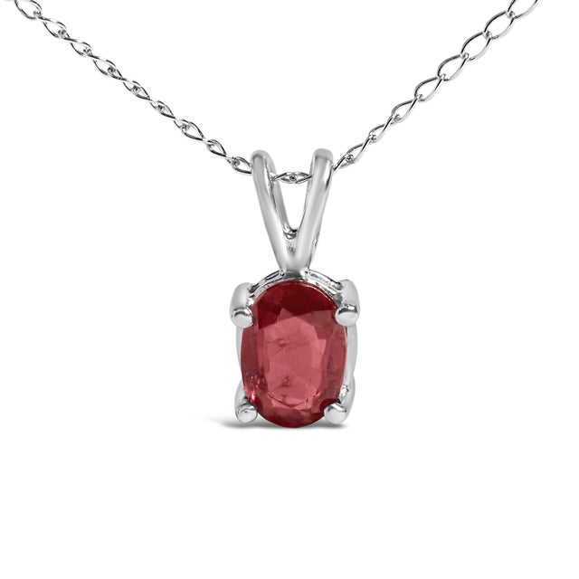 Elegance distilled into a mesmerizing piece, this pendant necklace crafted in 14K white gold features a sensual 6x4mm...