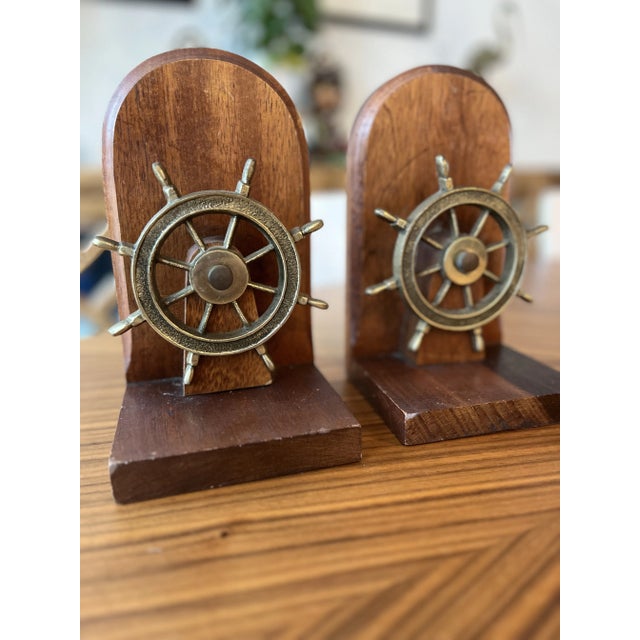 Steer your way into a nautical aesthetic with these ship's wheel bookends. Perfect for the library in the man's cave or to...