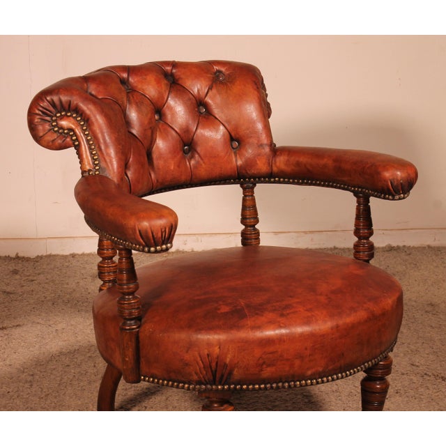 Charming small 19th-century mahogany and cognac leather armchair or bergère. This small armchair is full of charm and has...