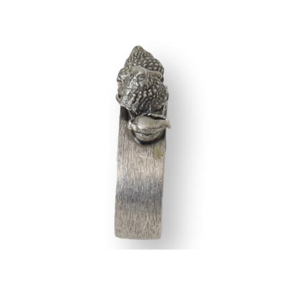 A charming set of pewter napkin rings adorned with delicate seashell motifs, bringing an understated coastal elegance to...