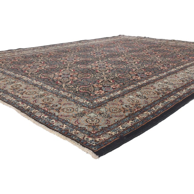 76188 Vintage Persian Mashhad Rug, 08'05 x 11'02. Traditional sensibility meets regal enchantment in this hand knotted...
