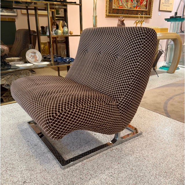 A stunning vintage low profile, wide lounge chair with elegant cantilever chrome base, designed by Adrian Pearsall for...
