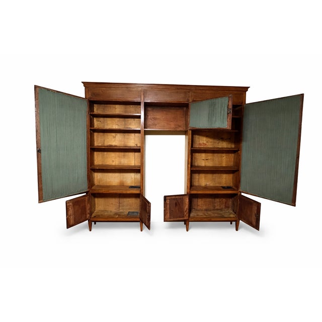 A rare and highly architectural 17th century Bolognese walnut bookcase of exceptional scale and integrity, retaining its...