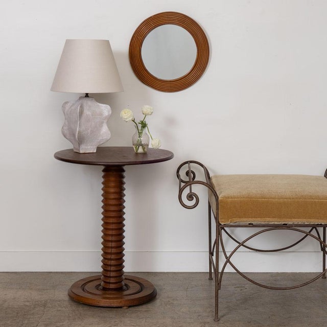 Beautiful carved wood table by Charles Dudouyt, made in France, 1940s. Thick carved wood stem with circular top and base....