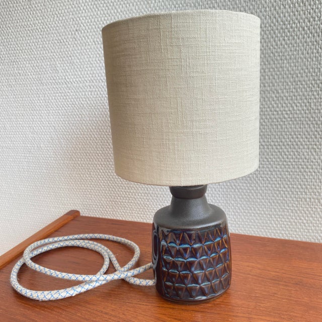 A small and beautifully resolved stoneware table lamp from the celebrated blue series by einar johansen for søholm...