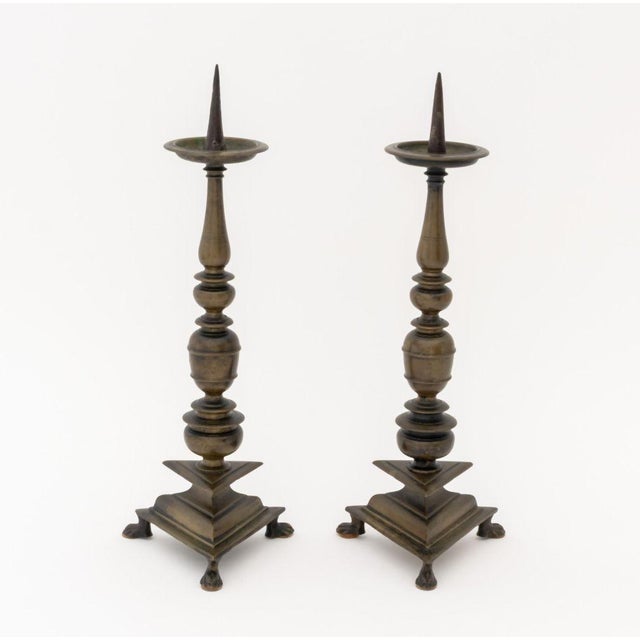 Italian Baroque Patinated Bronze Altar Pricket Candlesticks, circa 1600, triangular base on three paw feet. 19.75" H x 6"...