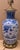 Blue and white Asian style ceramic/porcelain with brass(?). Approx. 7.5”w x 34”h (with finial) Does not include shade....