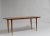Swedish Scandinavian modern teak table from the 1960s. The coffee table has round slider legs with brass finishes. Good...