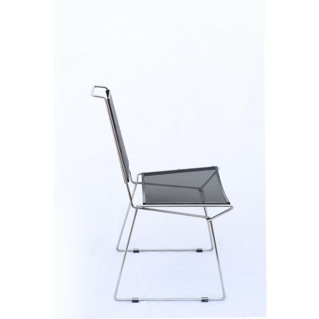 Rare seating furniture from the 80s. Elegant chrome-plated steel and lacquered sheet steel in the style of Mategot...