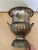 The Vintage Silver Tone Distressed Urn Champagne Bucket Ice Bucket is a stylish and unique addition to any barware...