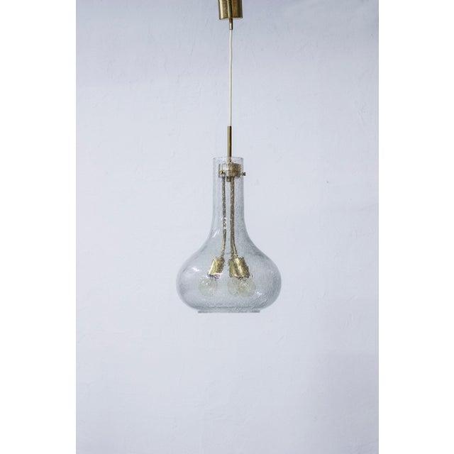 Large pendant ceiling lamp attributed to norwegian designer jonas hidle and høvik lys. Made from polished brass and hand...