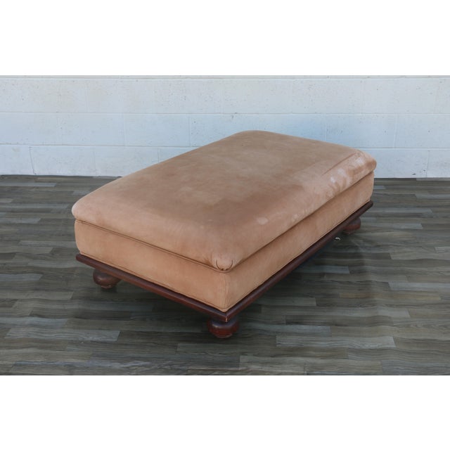 A handsome oversized vintage leather ottoman with a warm, sophisticated look reminiscent of classic Ralph Lauren...